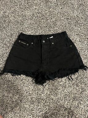 Calvin Klein high-rise black ripped shorts